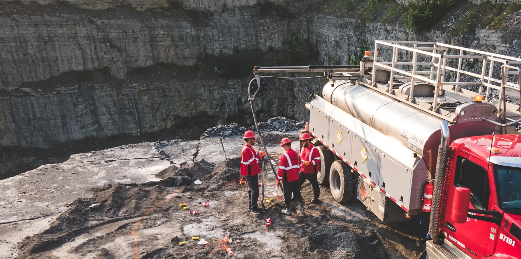 Blasters on site filling drilling holes